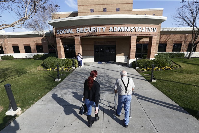 Carol Blevins and her father Ike Blevins walk into the Social Security office in North Texas...