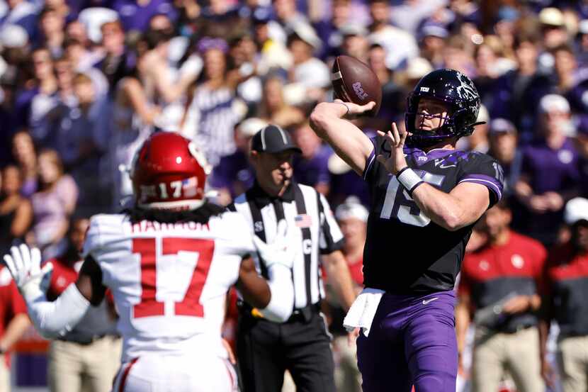 TCU quarterback Max Duggan (15) throws a touchdown pass as Oklahoma defensive back Damond...