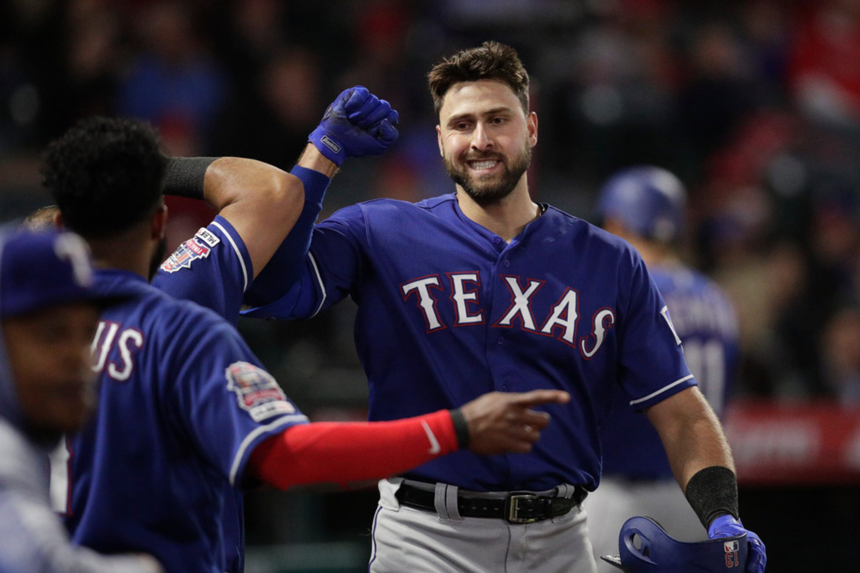 Texas Rangers' Joey Gallo celebrates his home run with teammates during the fourth inning of...