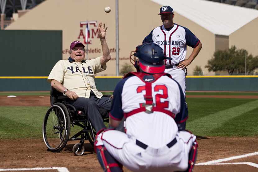 Former President George H. W. Bush throws out an opening pitch to Texas A&M player Stephen...