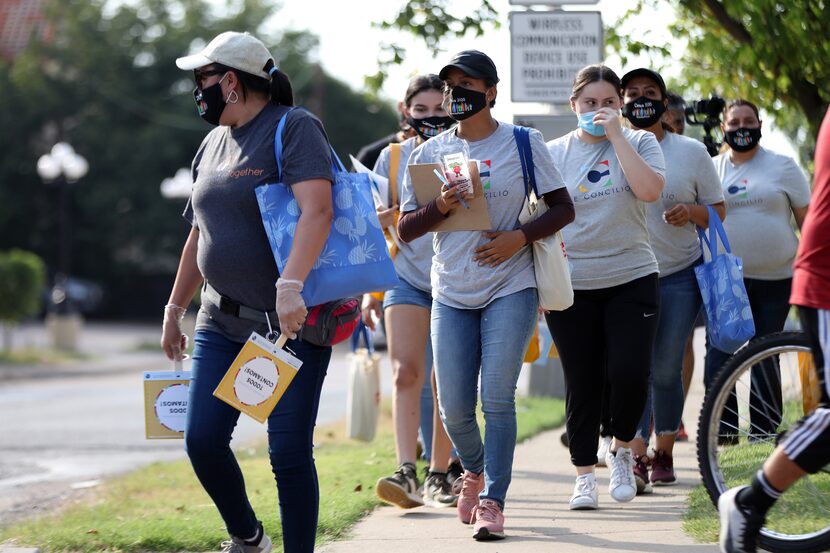 Volunteer moms with the Community Action Network walked door to door Aug. 5 inviting...