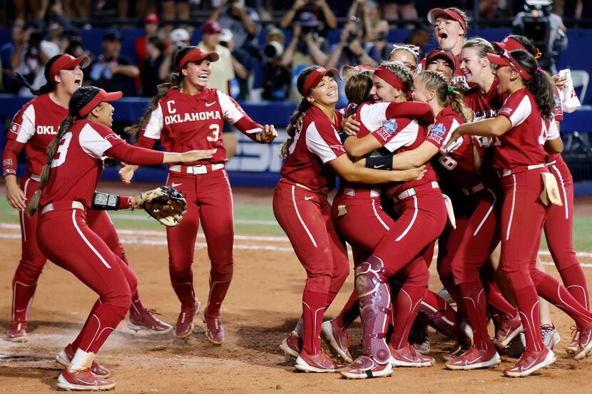 Oklahoma players celebrate after winning the second game of the NCAA Women's College World...