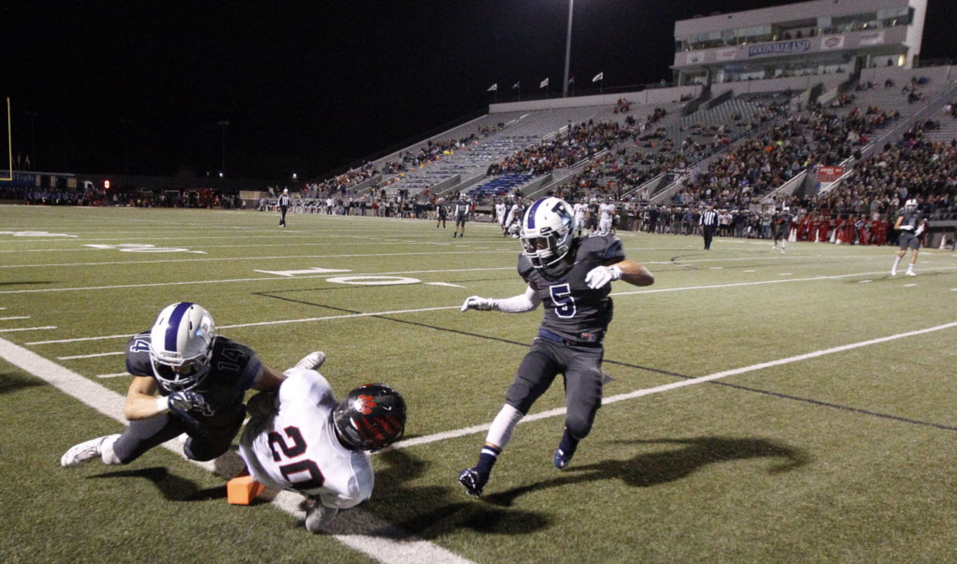 Colleyville Heritage sophomore wide receiver Ke'von Ahmad (20) scores a touchdown as...