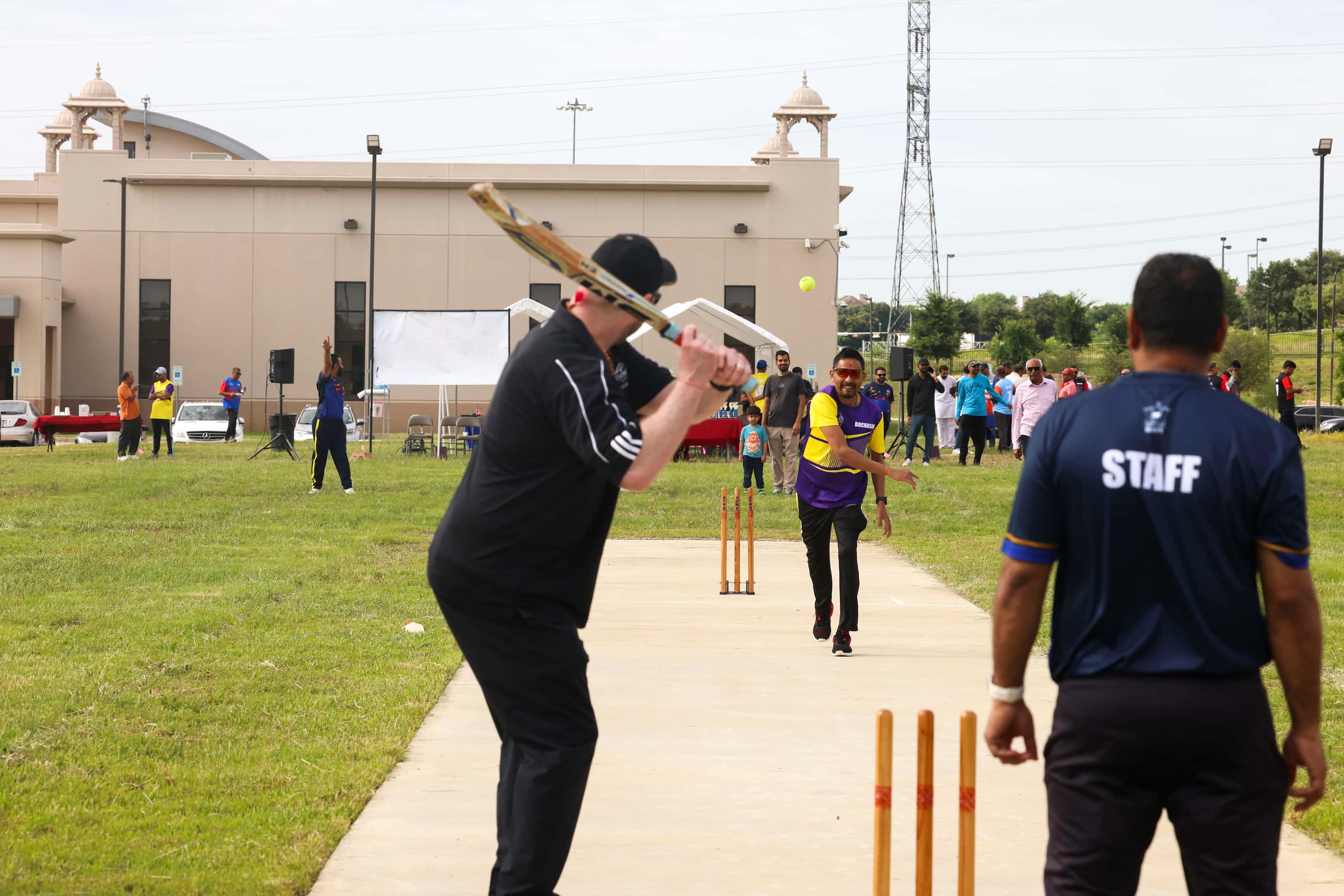 Irving city council member Brad LaMorgese, bats during a ceremonial cricket game ahead of a...