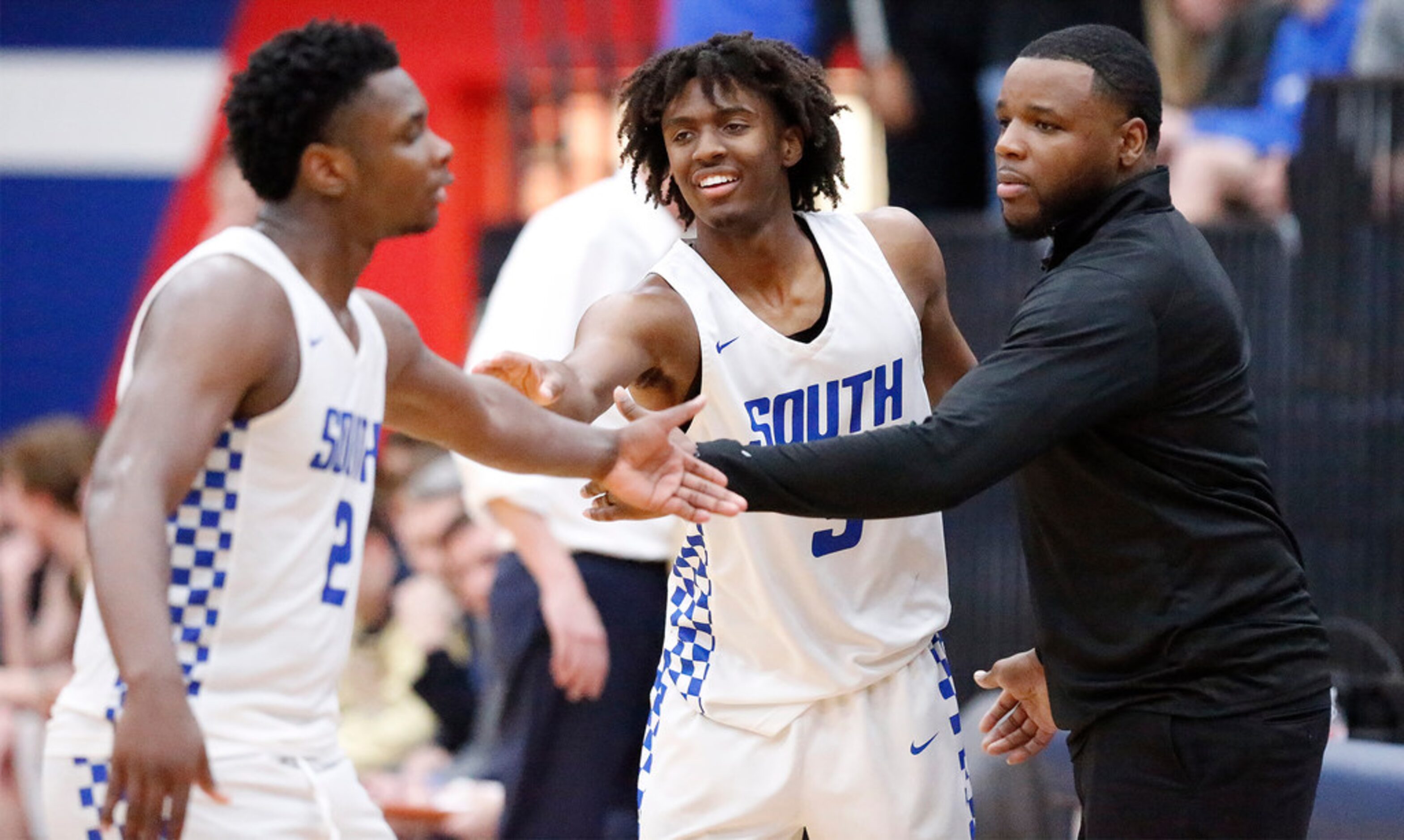 South Garland High School guard Chris Harris Jr (2) is congratulated by South Garland High...