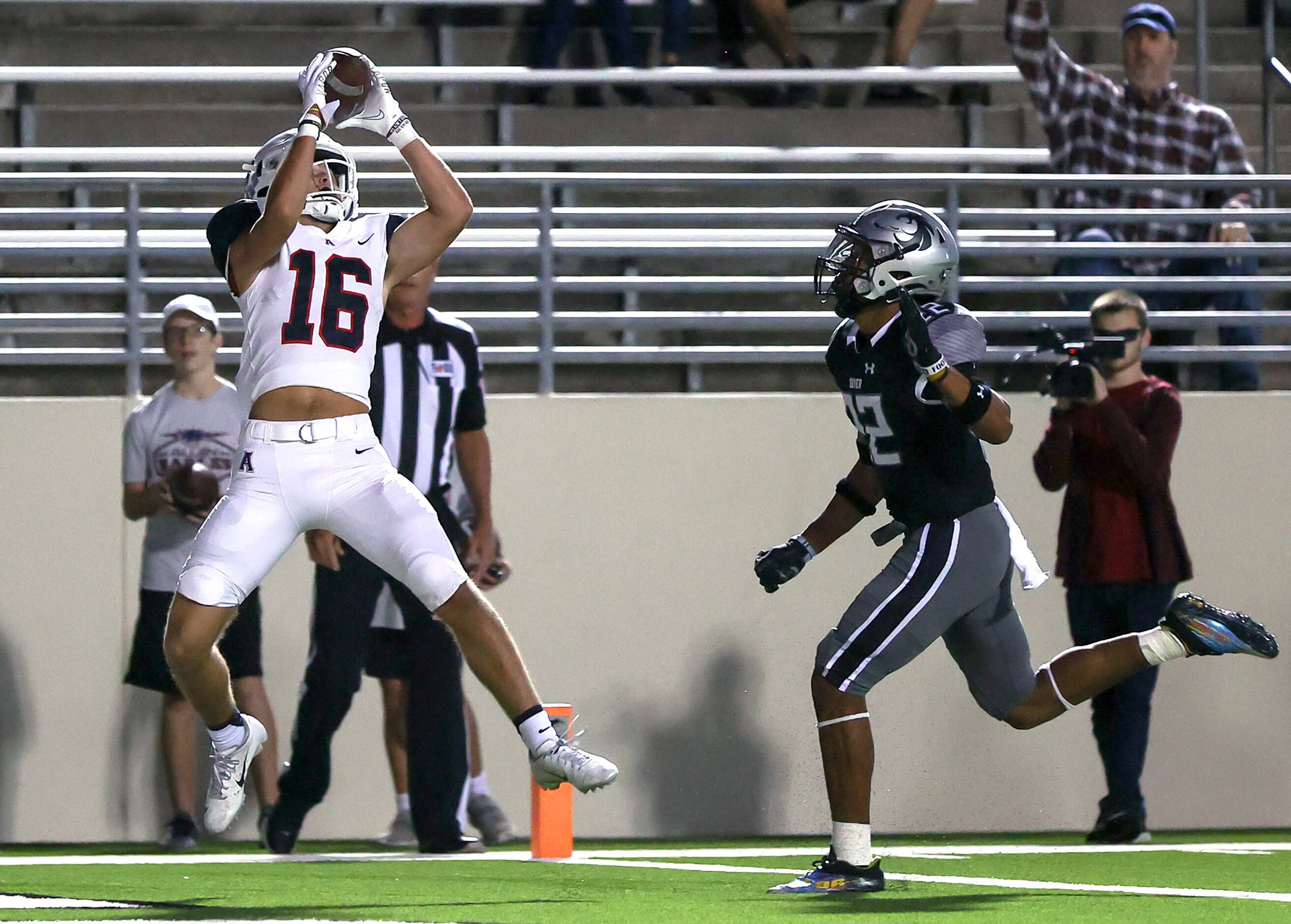 Allen wide receiver Jacob Brasher (16) comes up with a touchdown reception against Denton...