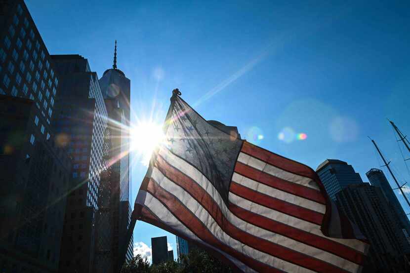 An American flag flutters in the wind near the National 9/11 Memorial & Museum in New York...