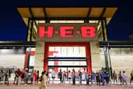 Customers wait in line ahead of the opening of H-E-B on Wednesday, July 19, 2023 in McKinney. 