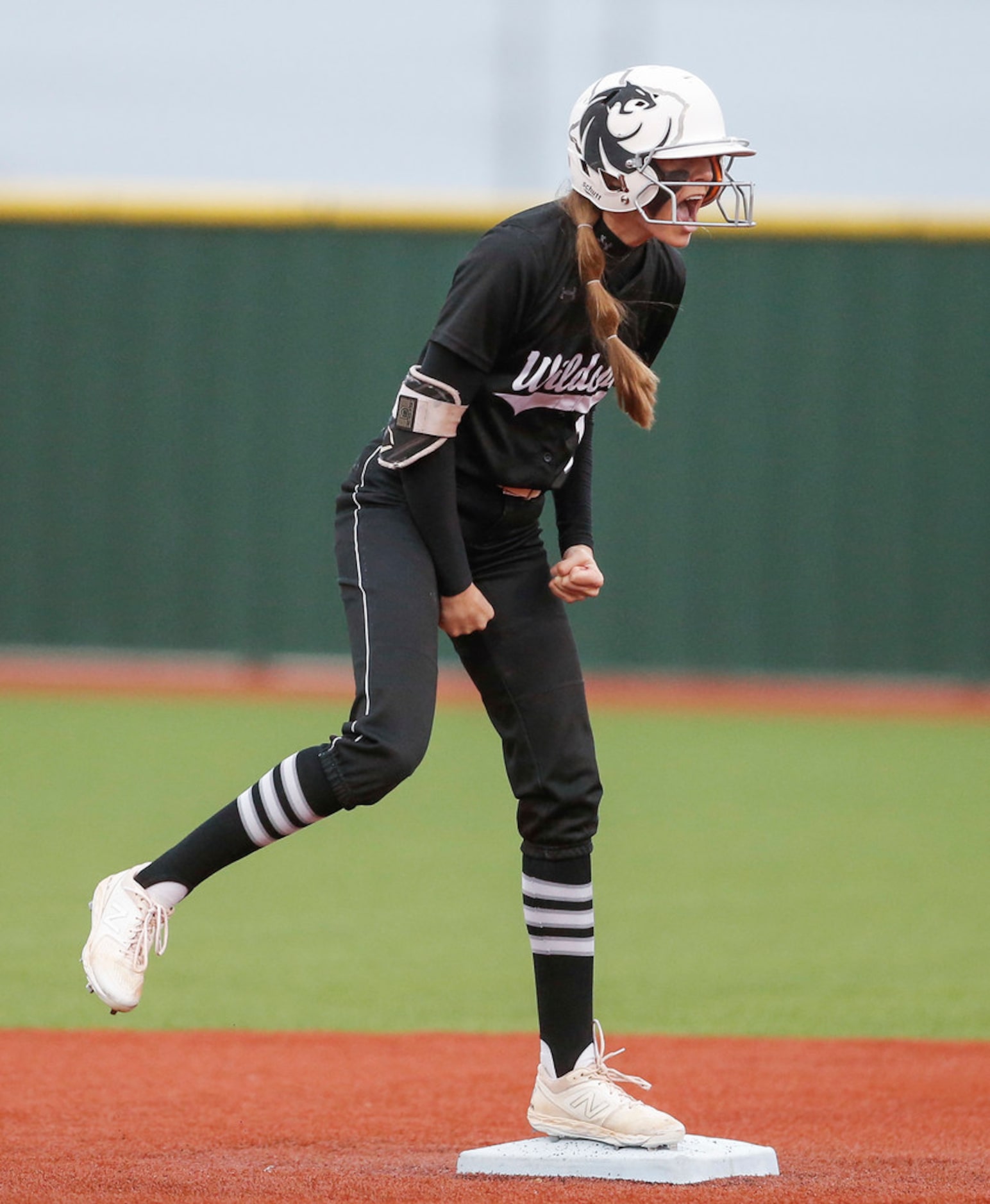 Denton GuyerÃs Morgan Medford celebrates reaching second after Eaton first baseman Kenzlee...