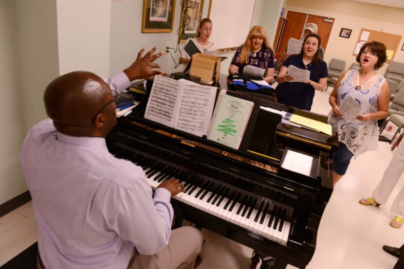 Director Isiak Holiday Jr. leads members of the Lakeside Civic Chorus during its weekly...