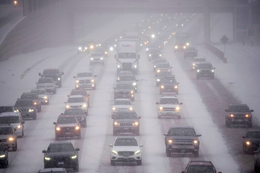 Rush hour traffic travels southbound on Interstate 35W in Minneapolis as a winter storm hit...