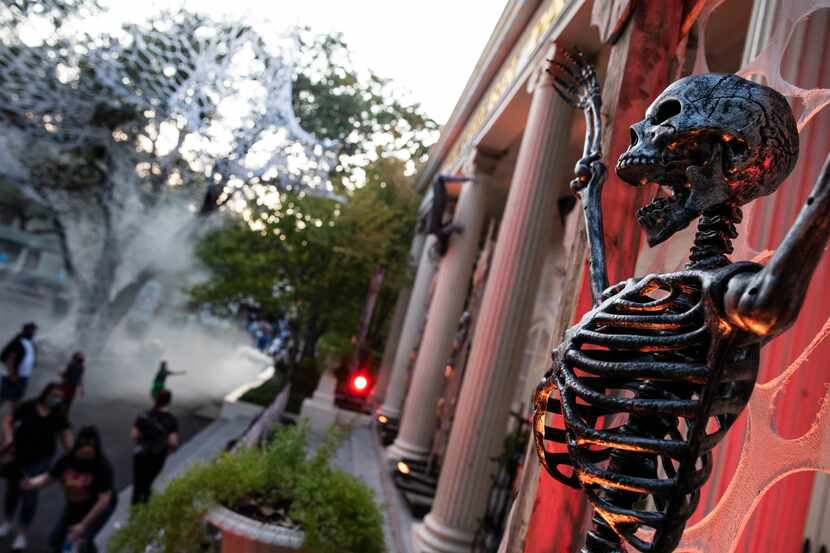 A skelton hangs as part of a display at Six Flags Hallowfest in Arlington on Saturday, Oct. 3.