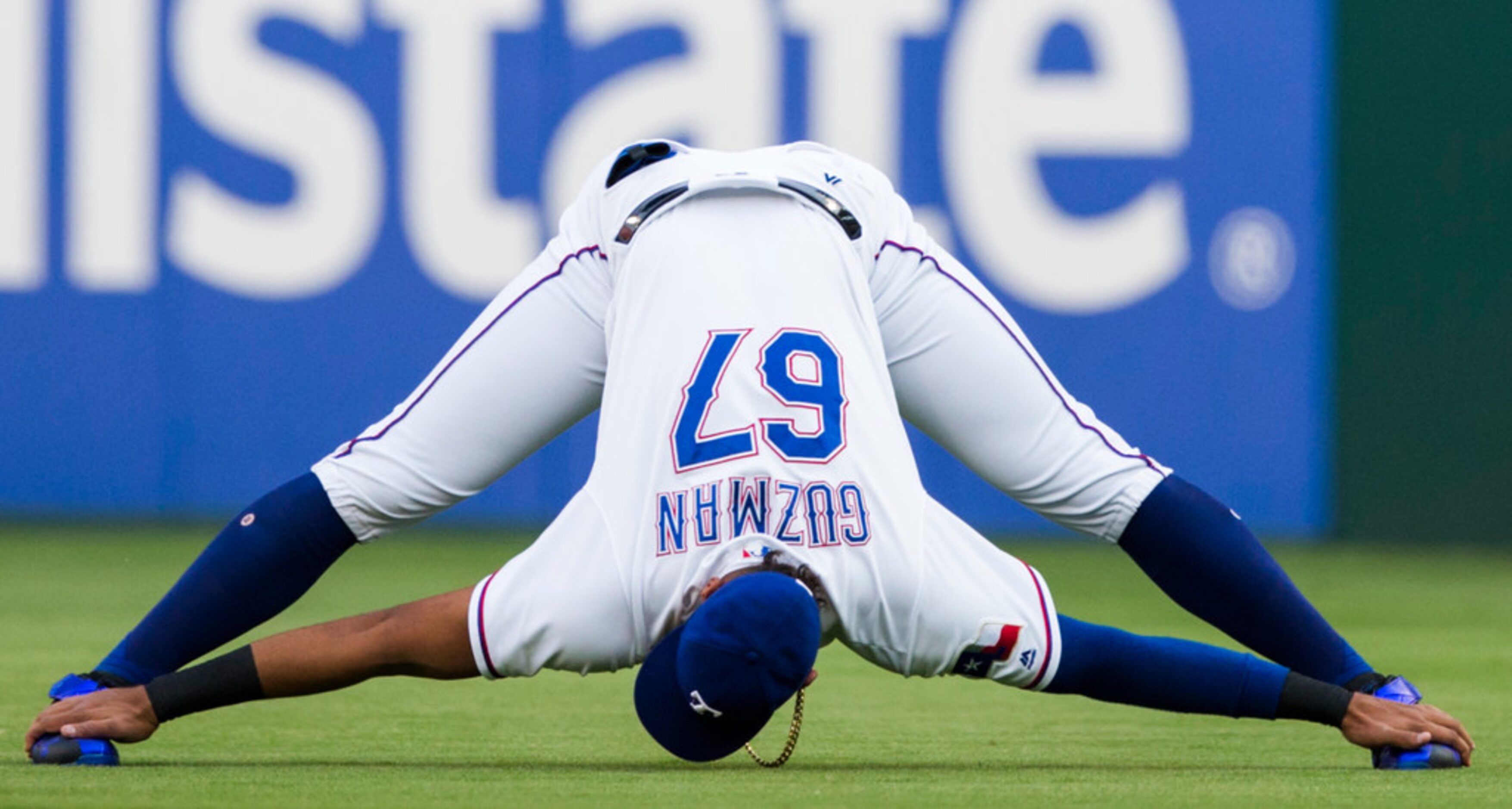 Texas Rangers first baseman Ronald Guzman (67) stretches before an MLB game between the...