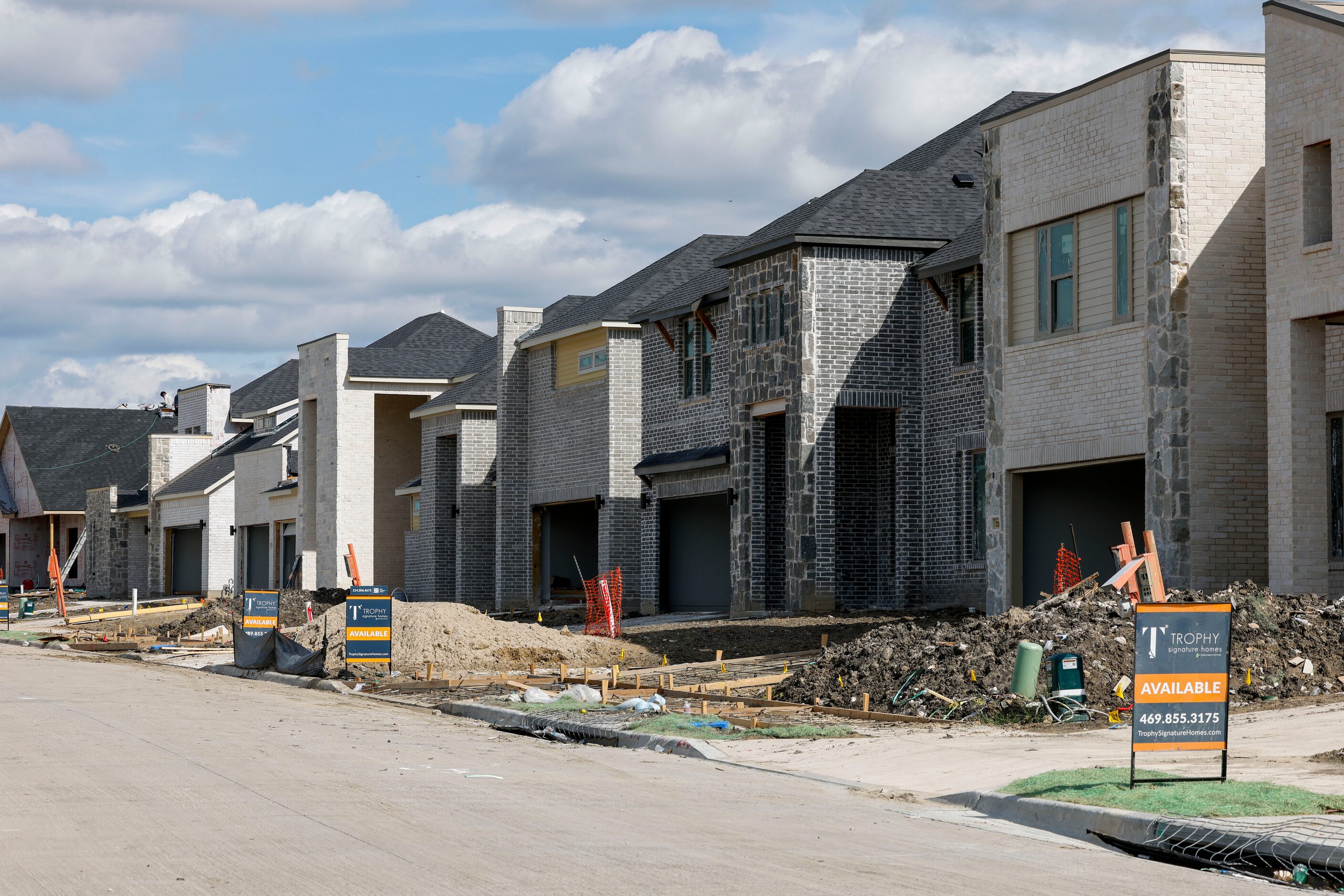 A row of houses are under construction in the Lake Pointe development in Lavon.