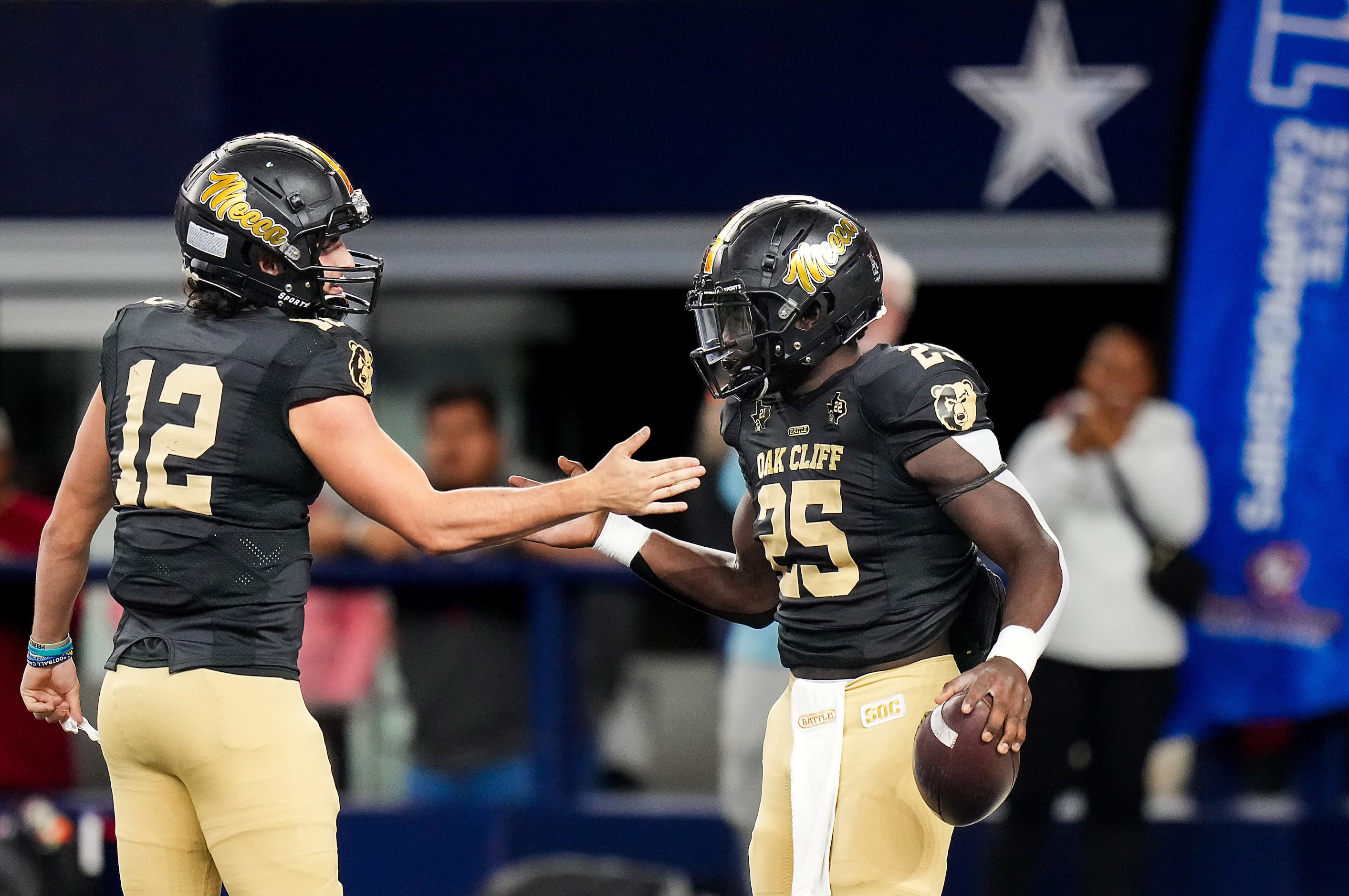 South Oak Cliff running back Damond Williams (25) celebrates with quarterback Carter Kopecky...