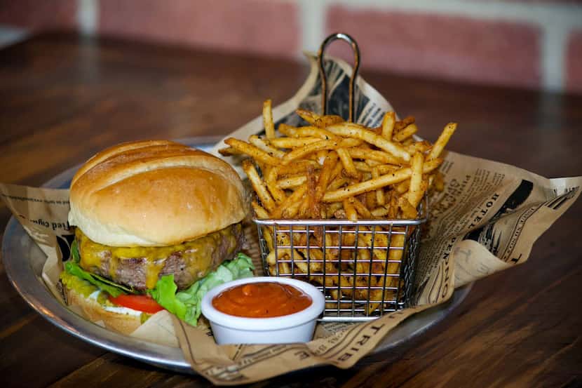 The cheeseburger is made with Akaushi beef and topped with a bun from Village Baking Co. in...