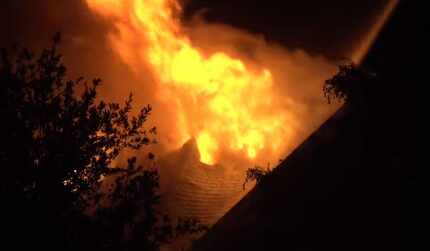 Fire burned through the roof of a home in Keller on Wednesday morning. Lightning was...