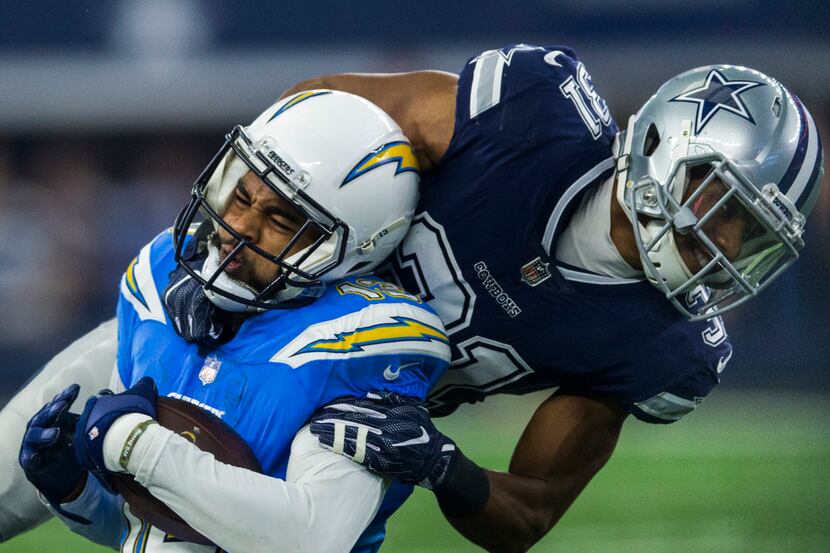 Dallas Cowboys free safety Byron Jones (31) tackles Los Angeles Chargers wide receiver...