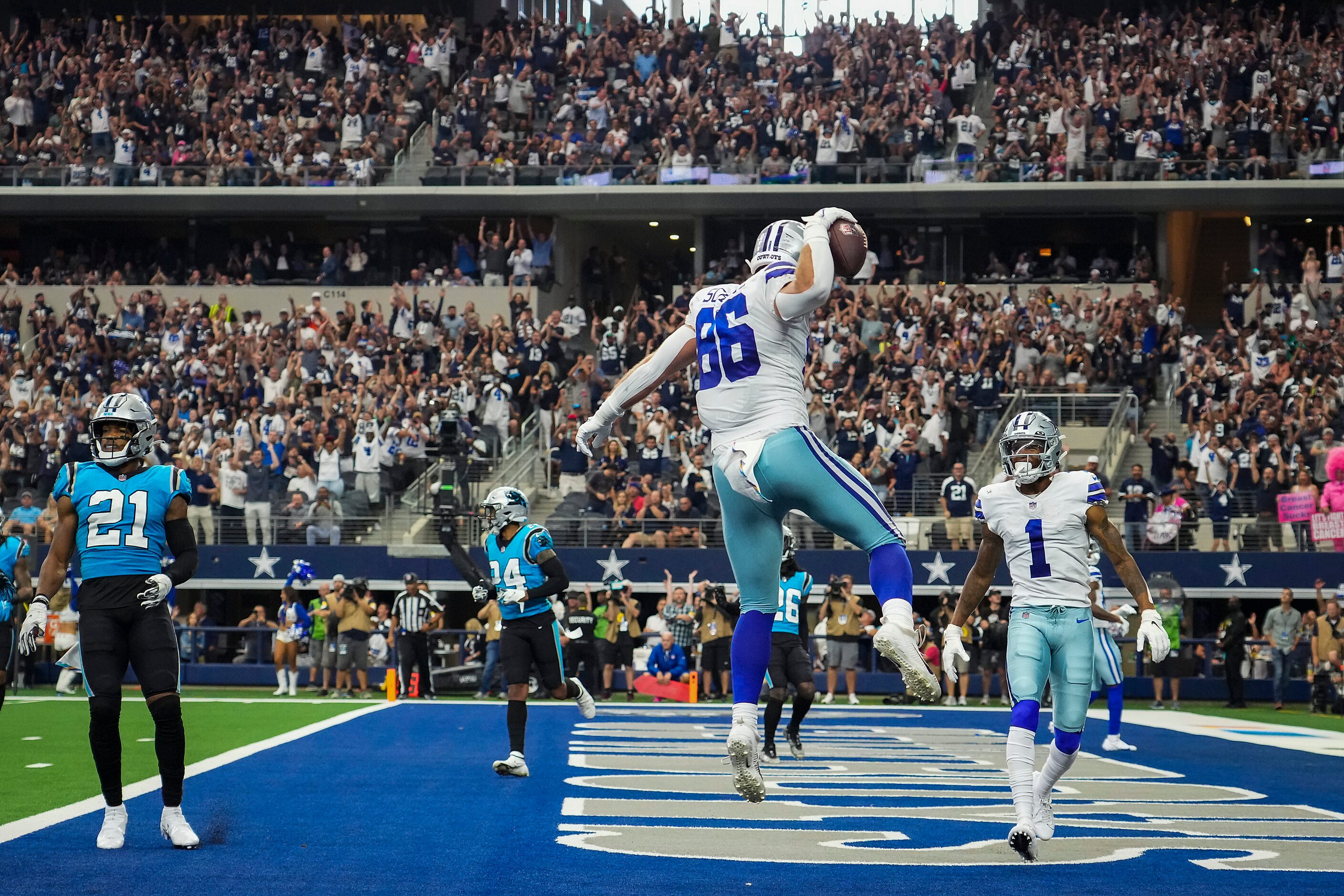 Dallas Cowboys tight end Dalton Schultz (86) celebrates with wide receiver Ced Wilson (1)...