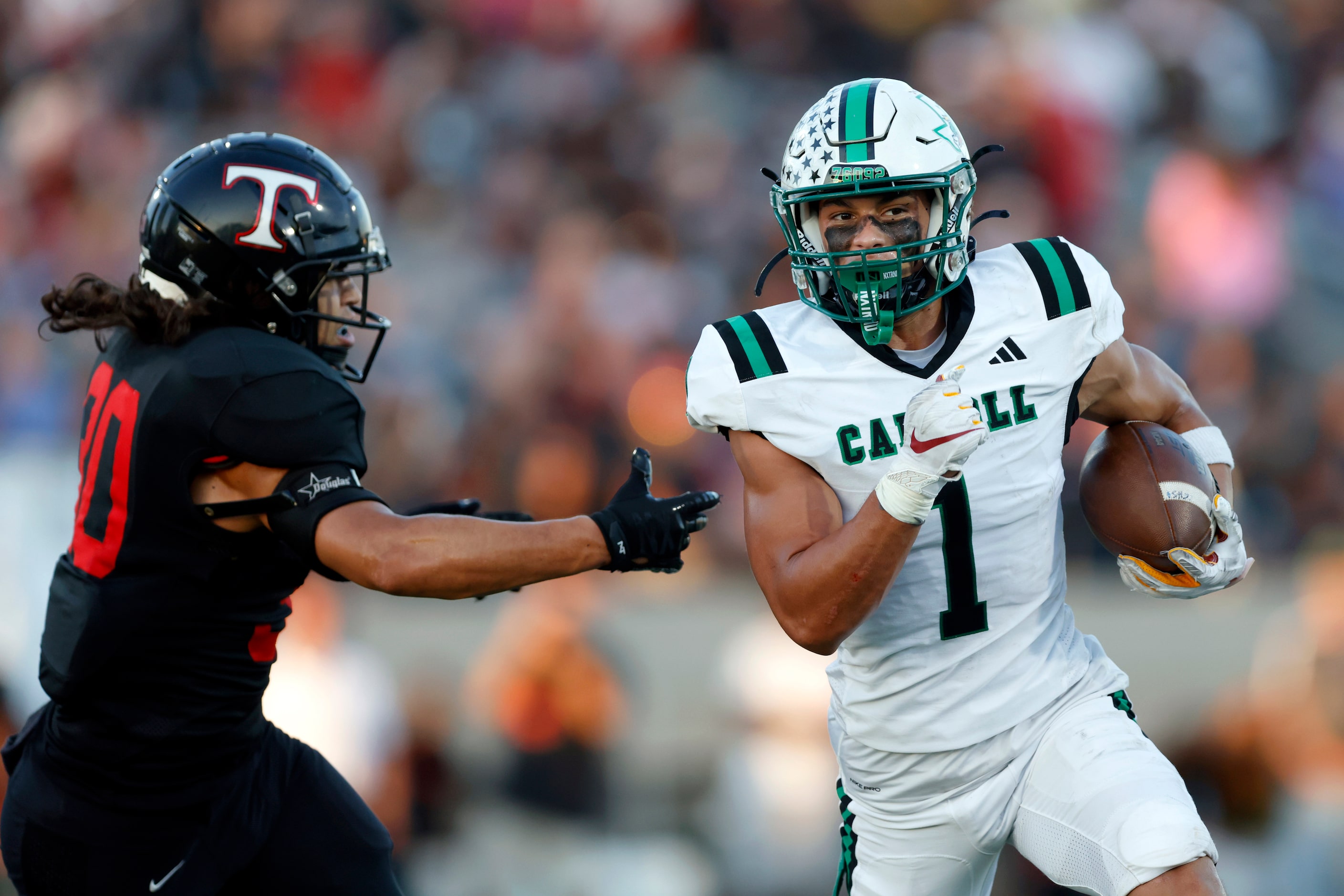 Southlake Carroll running back Riley Wormley (1) runs past Euless Trinity linebacker John...