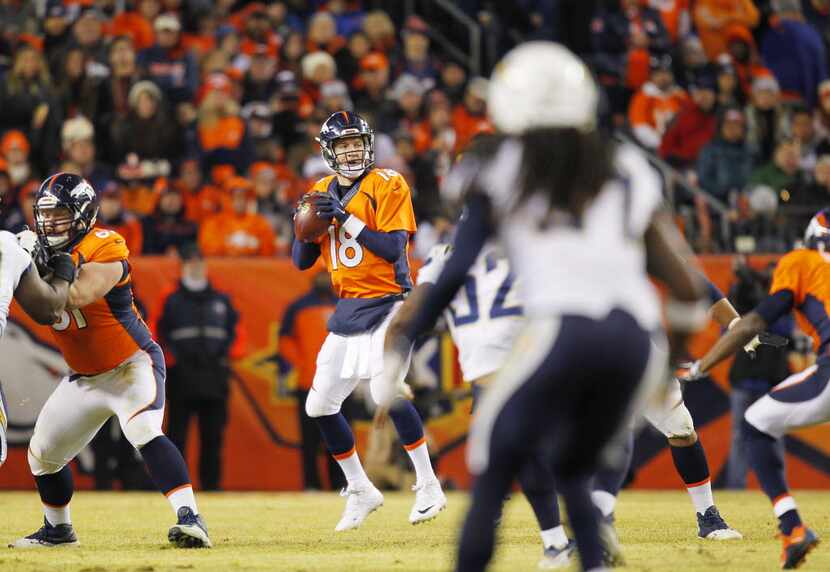 Denver Broncos quarterback Peyton Manning drops back to pass on Sunday, Jan. 3, 2016, at...