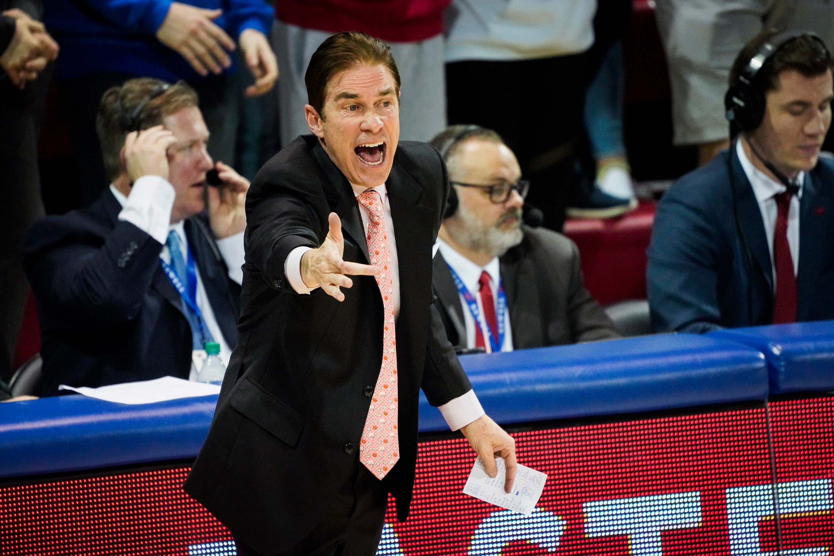 SMU head coach Tim Jankovich yells to his players during the first half of an NCAA...