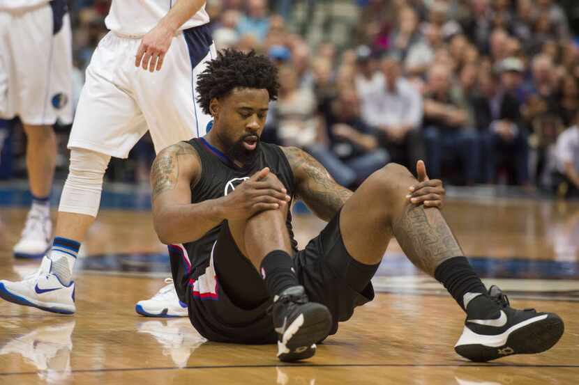 Mar 7, 2016; Dallas, TX, USA; Los Angeles Clippers center DeAndre Jordan (6) is knocked to...