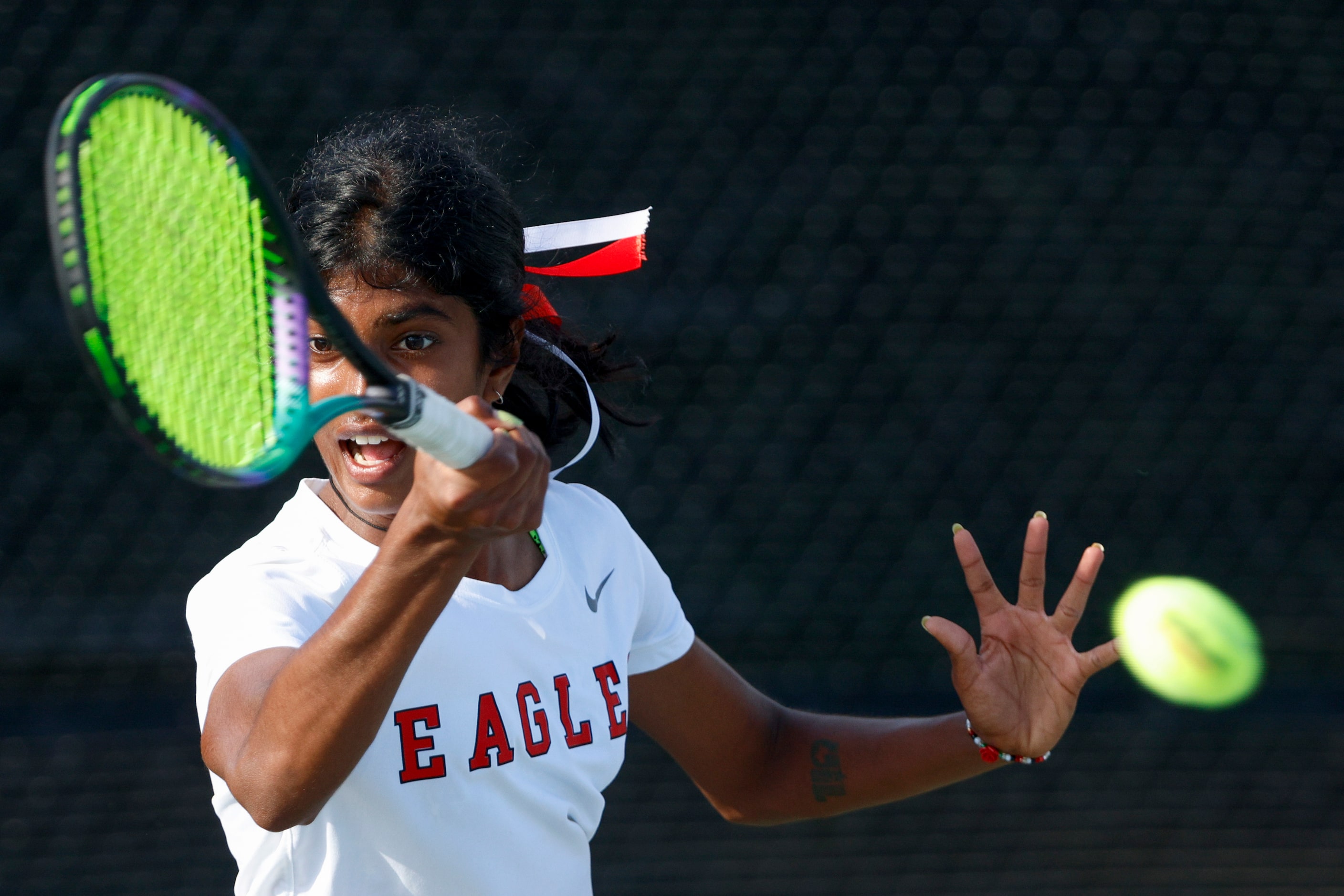 Argyle’s Meghna Arun Kuma hits a return shot during the 4A girls singles championship match...