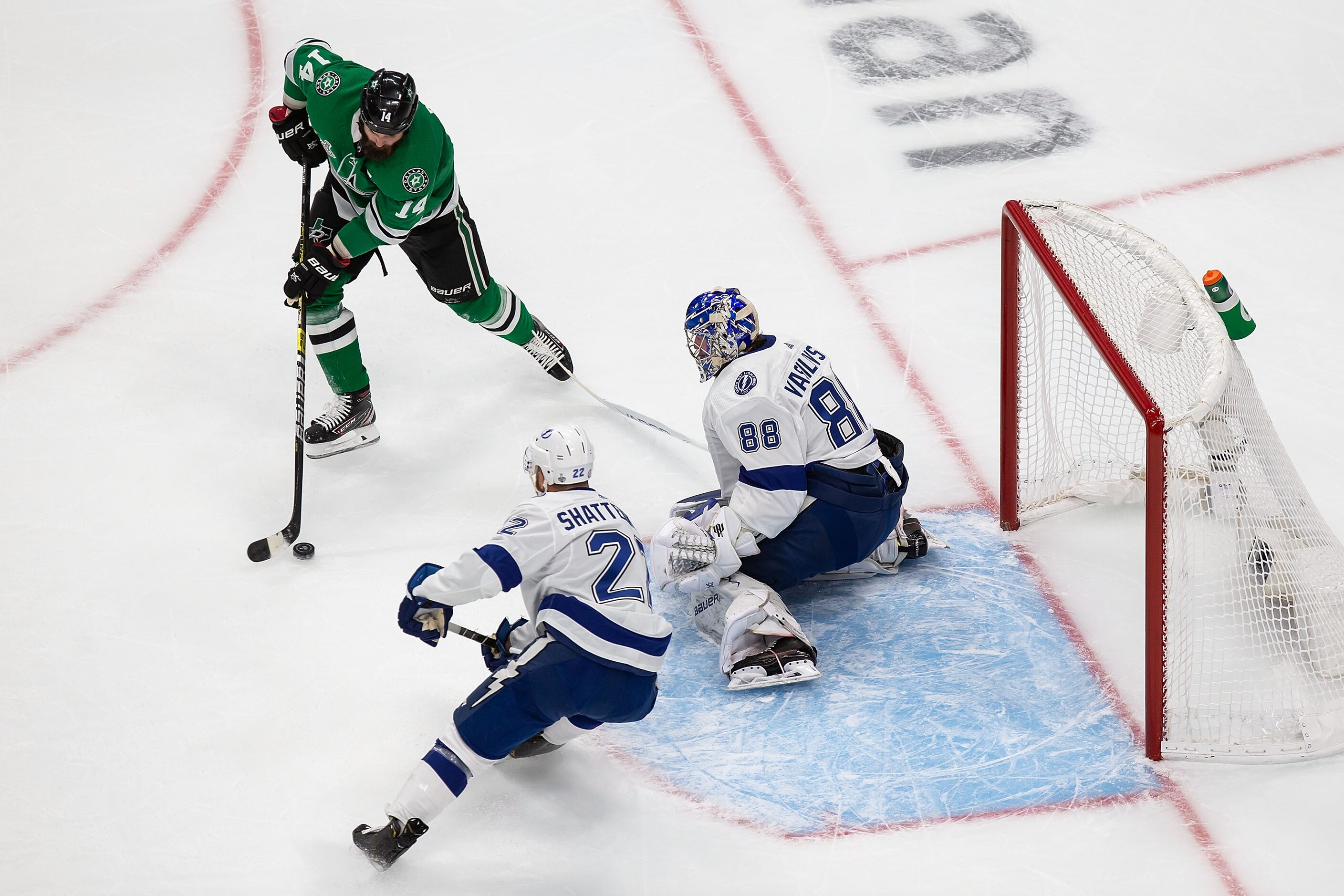 Jamie Benn (14) of the Dallas Stars looks for a shot against goaltender Andrei Vasilevskiy...