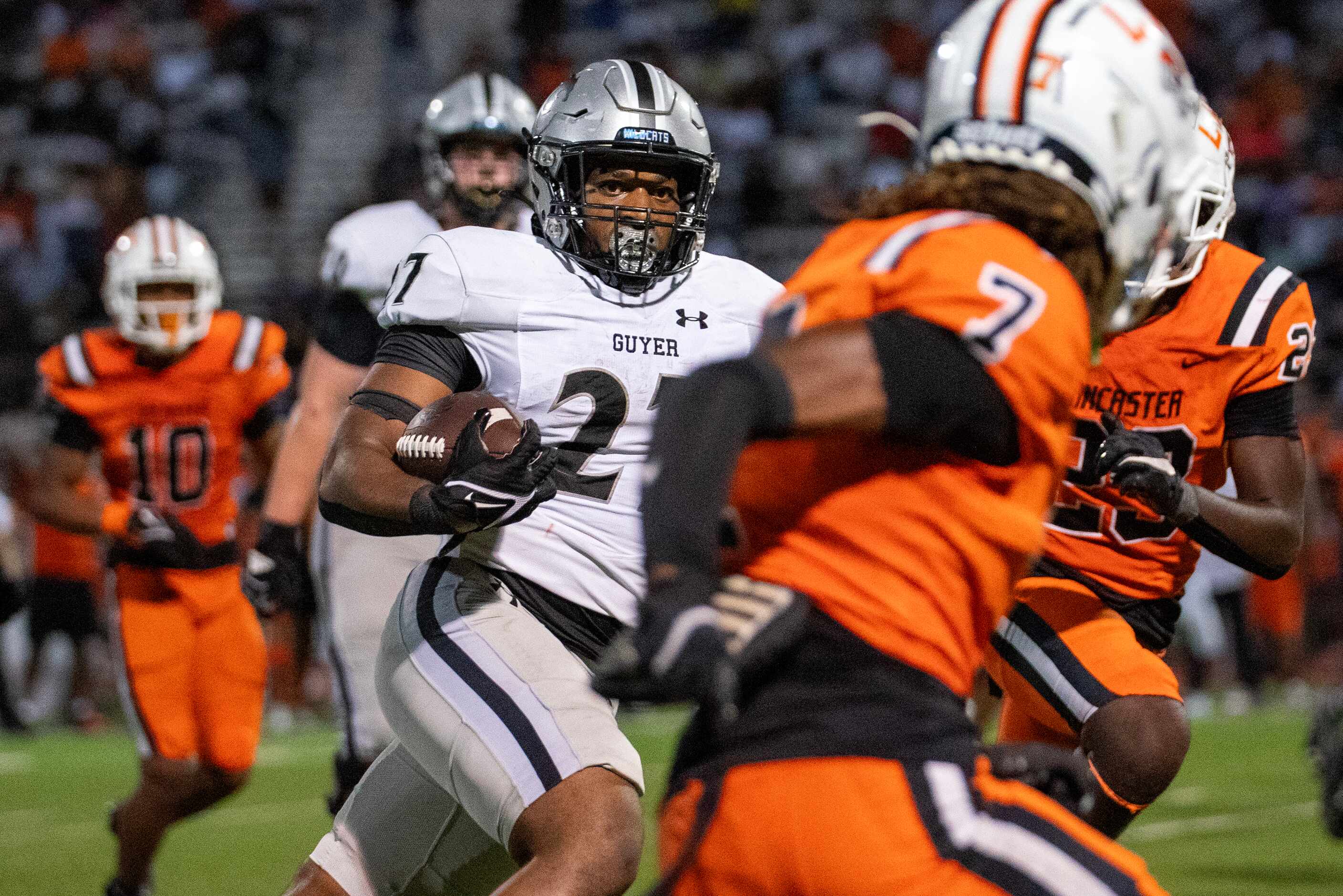 Denton Guyer sophomore running back DJ Black (27) cuts upfield against Lancaster senior...