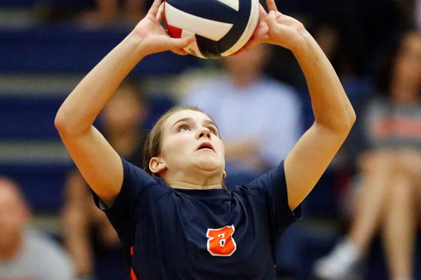 Frisco Wakeland setter Maddy Shew (8) makes a set in a recent match. Wakeland stayed on the...