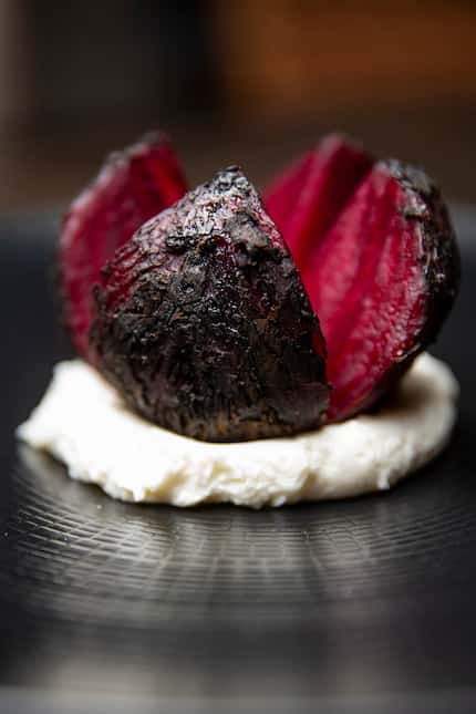 Beets, roasted in the wood-burning stove, are served atop goat cheese at Tulum.