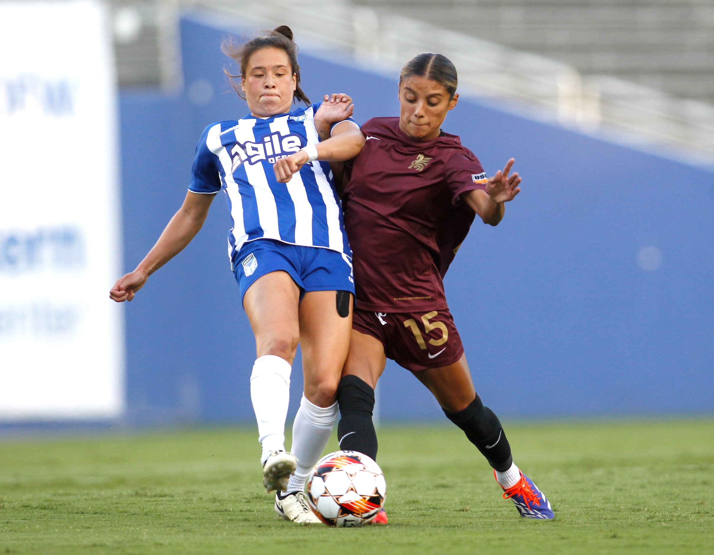 Dallas Trinity FC's Samantha Meza (15), right, challenges DC Power FC's Katelyn Duong (9)...