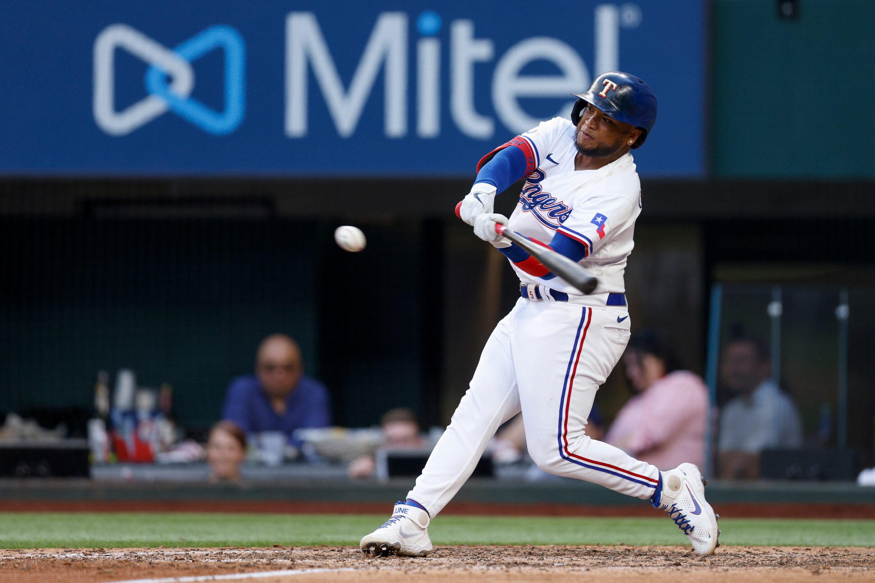 Texas Rangers left fielder Willie Calhoun (4) hits a game-tying home run during the ninth...