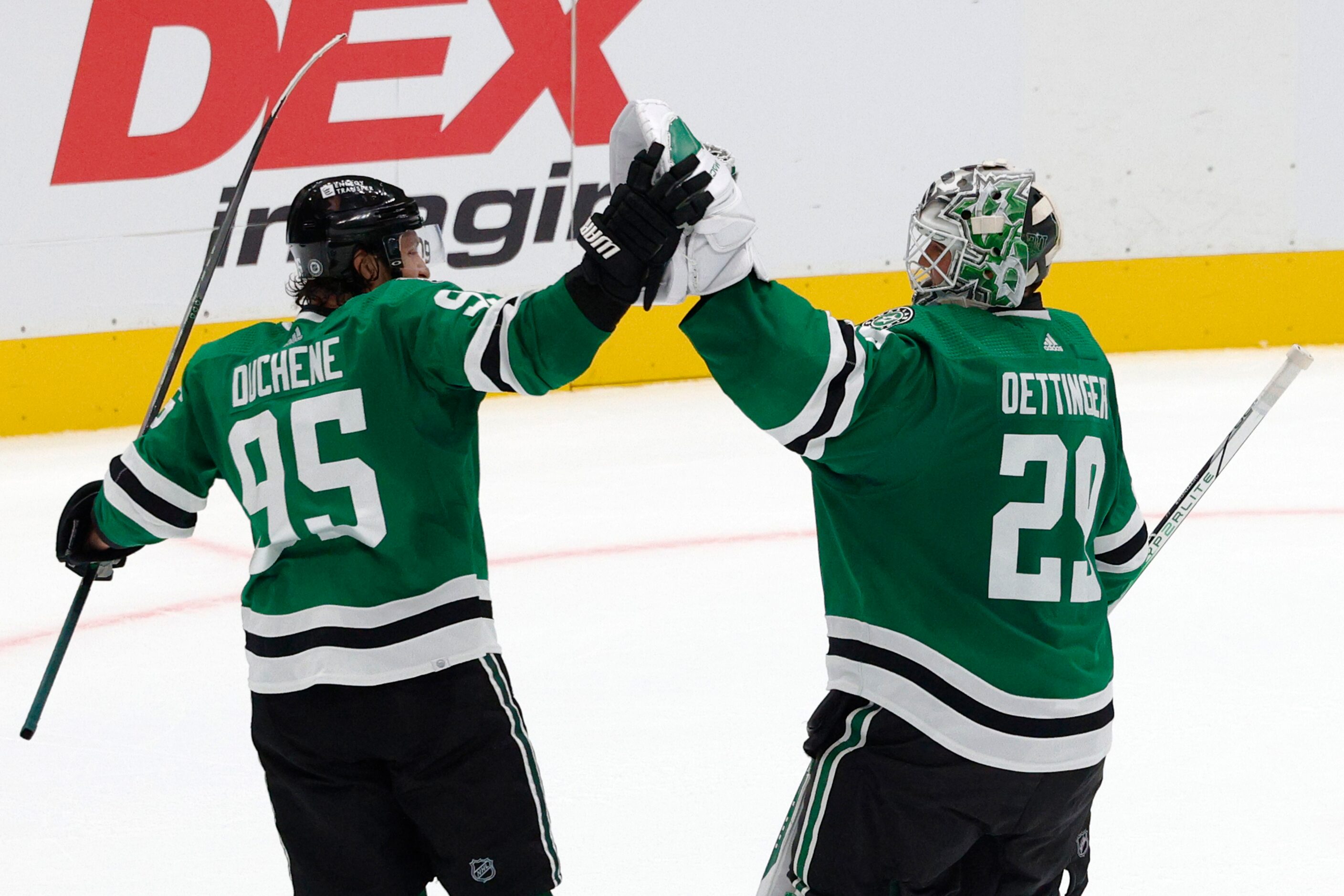 Dallas Stars center Matt Duchene (95) celebrates with goaltender Jake Oettinger (29) after a...