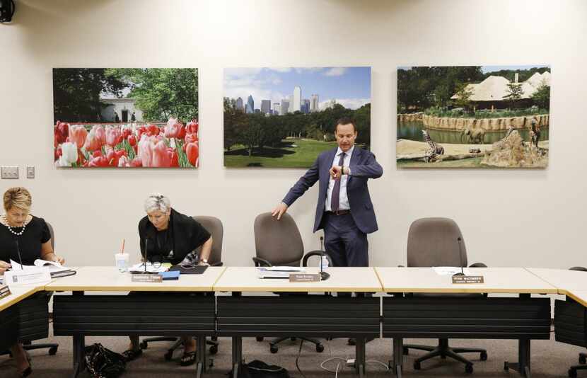 Brodsky checks his watch before leading a Dallas Animal Commission meeting at City Hall on...