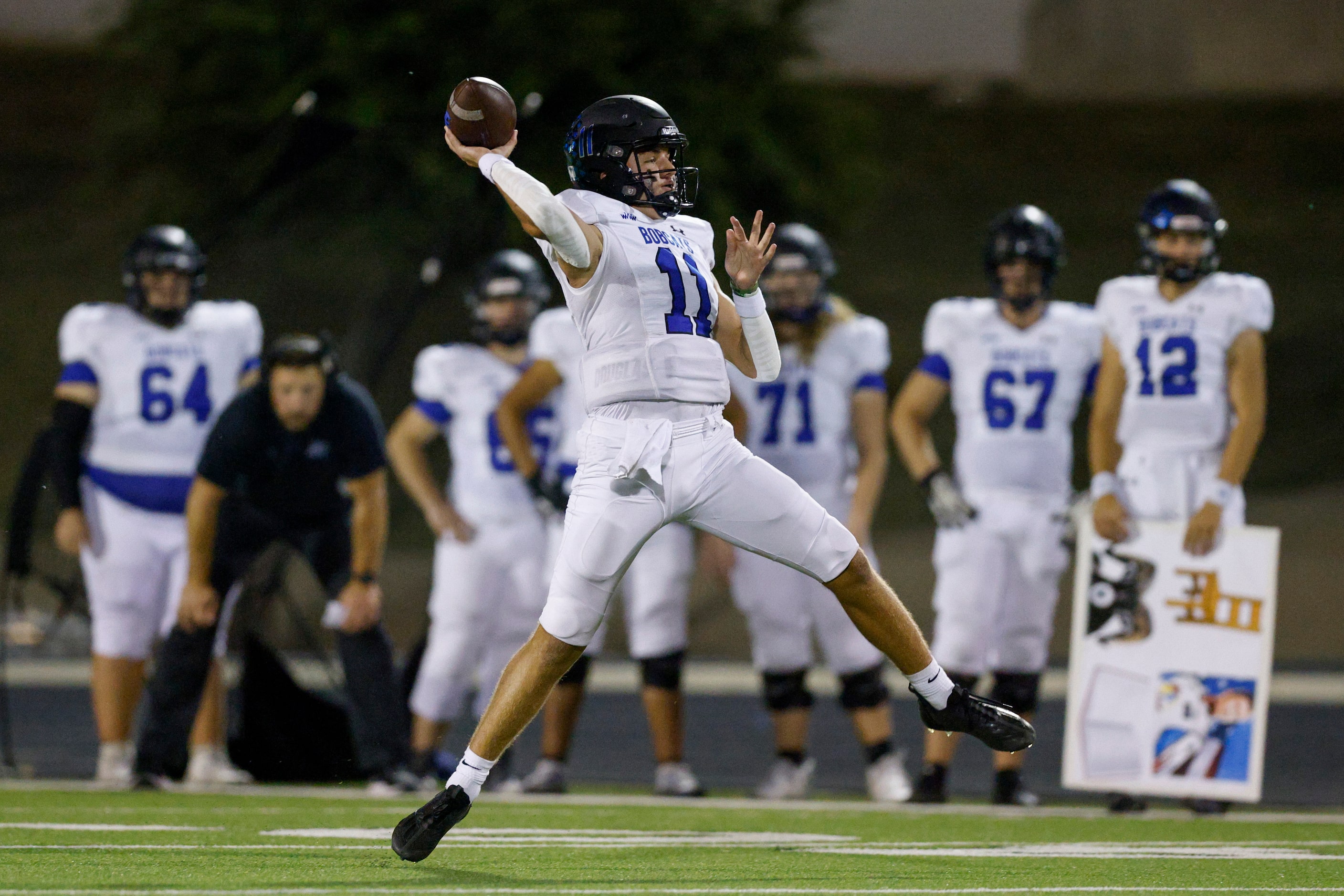 Trophy Club Byron Nelson quarterback Jake Wilson (11) throws a pass during the first half of...