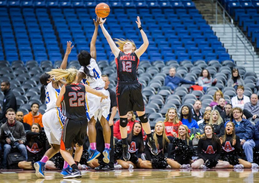 Argyle forward Vivian Gray (12) and Waco La Vega guard Yasmine Evans (4) reach for a rebound...