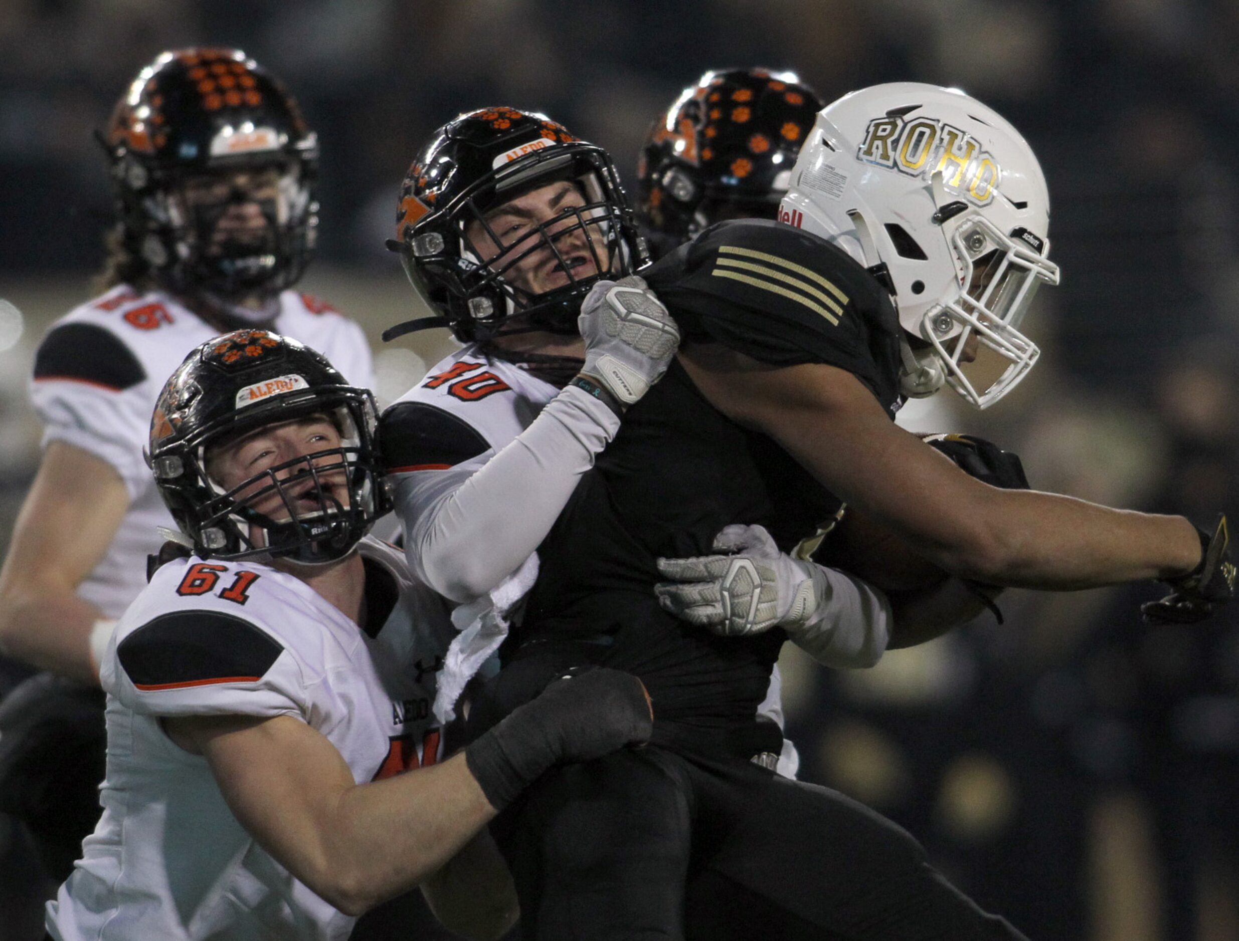 Wichita Falls Rider running back Anquan Willis (1) is stopped by Aledo defensive lineman...