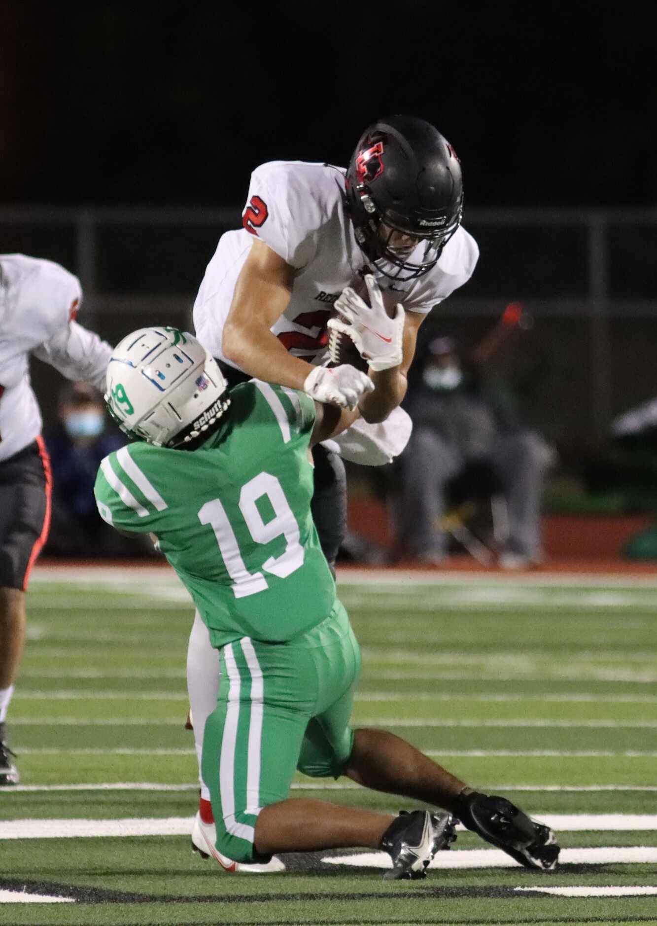 Lake Dallas defensive back Anthony Lunca (19) tackles Frisco Liberty wide receiver Connor...