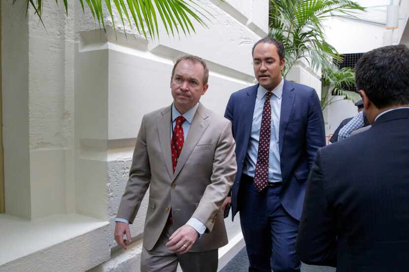 Rep. Will Hurd, R-Texas (right) and White House Budget Director Mick Mulvaney leave a March...