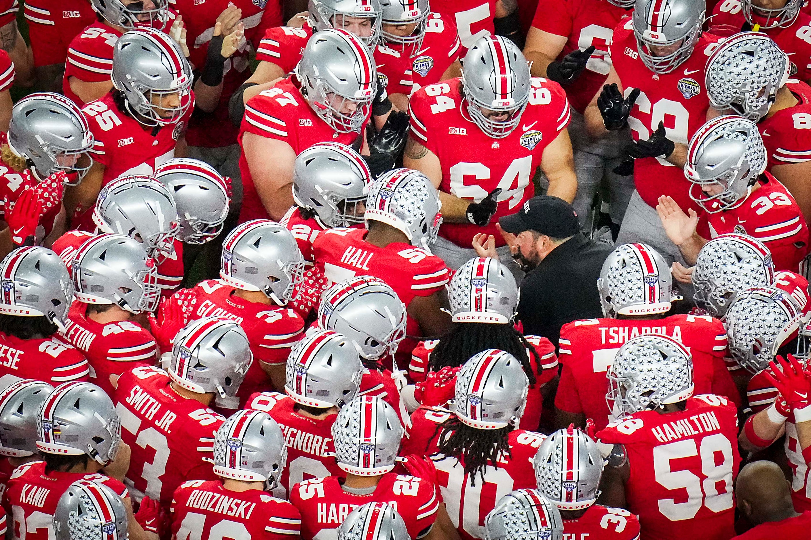 Ohio State players huddles around head coach Ryan Day before the Goodyear Cotton Bowl...