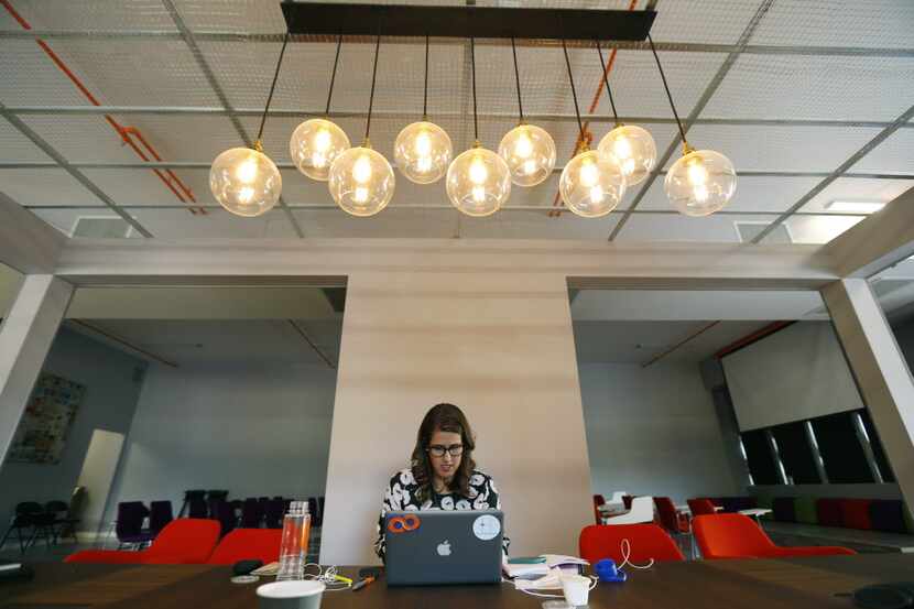 Tech Wildcatters Melanie Smith works at their new headquarters at the downtown tower in...