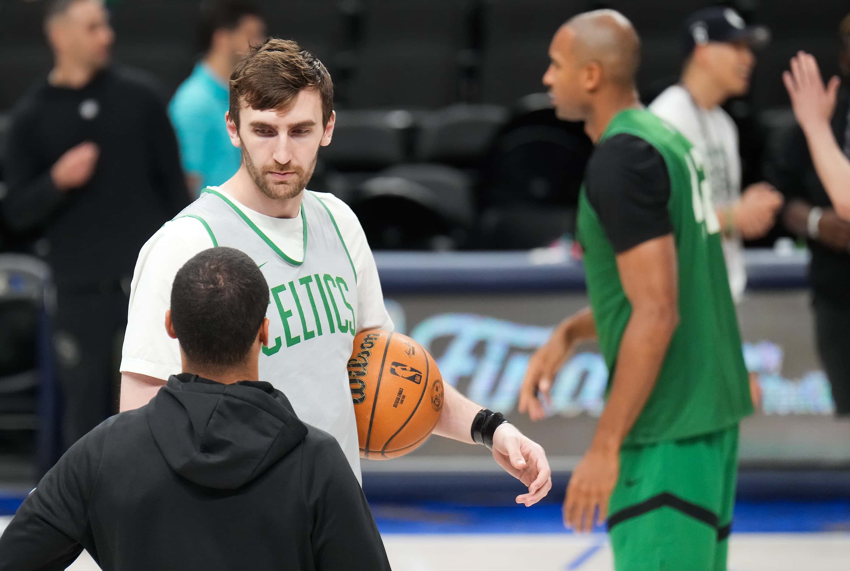 Boston Celtics center Luke Kornet talks with head coach Joe Mazzulla during a team practice...