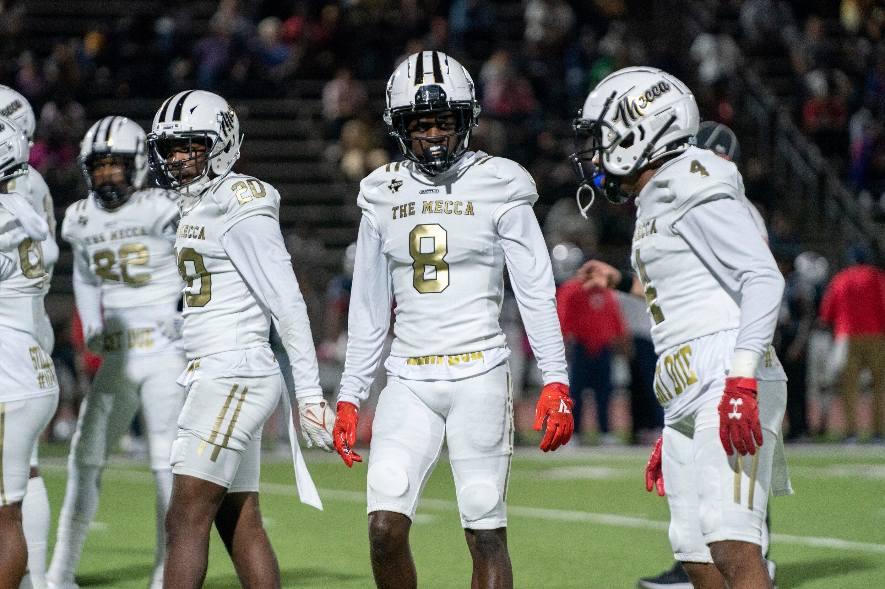 South Oak Cliff junior linebacker Brandon Jones (8) talks to teammates between plays during...