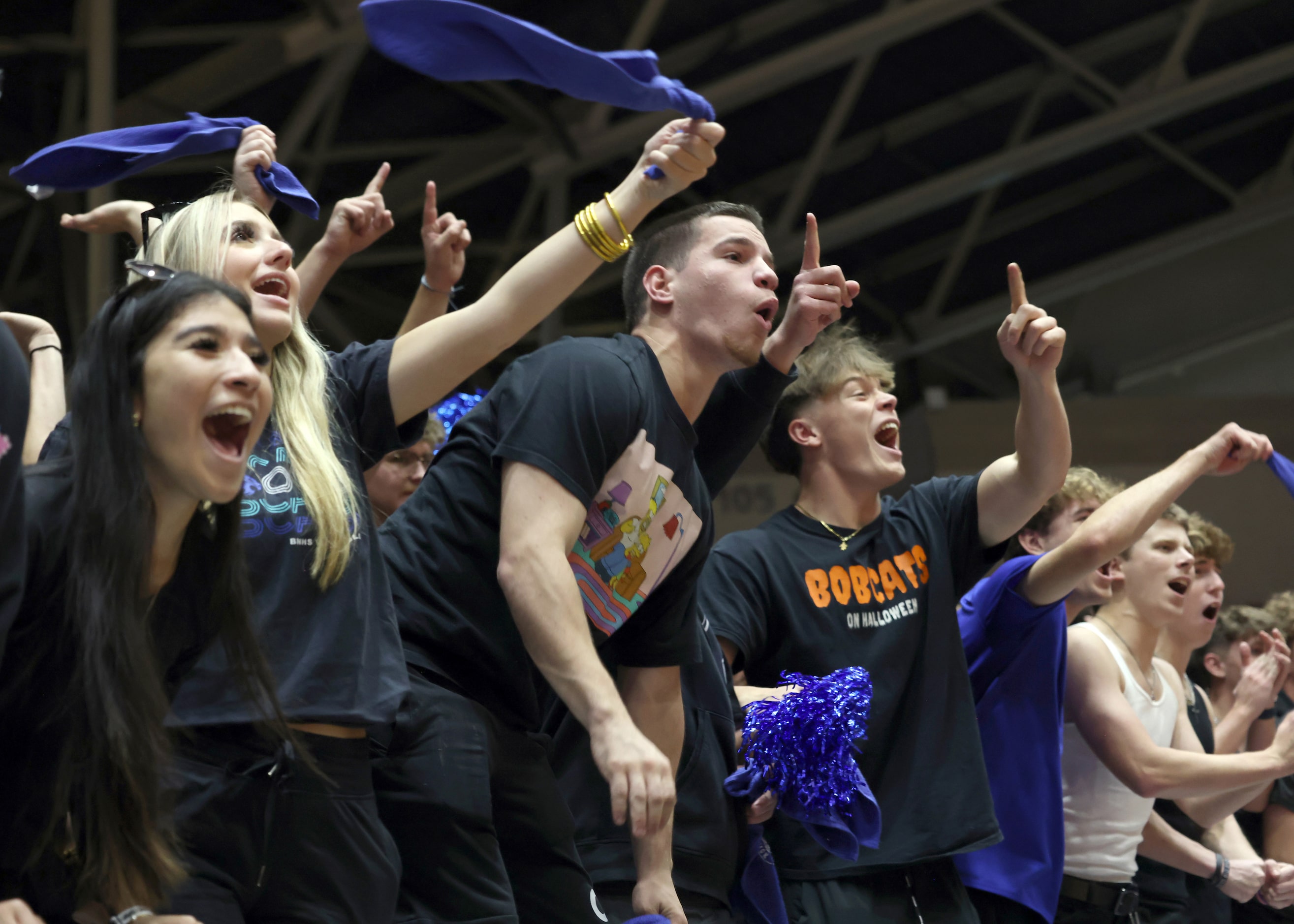 Byron Nelson fans filling the student section roar with approval after the Bobcats scored...