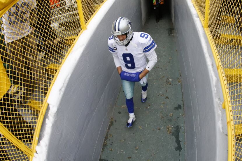 Dallas Cowboys quarterback Tony Romo (9) walks out of the tunnel to face the Green Bay...