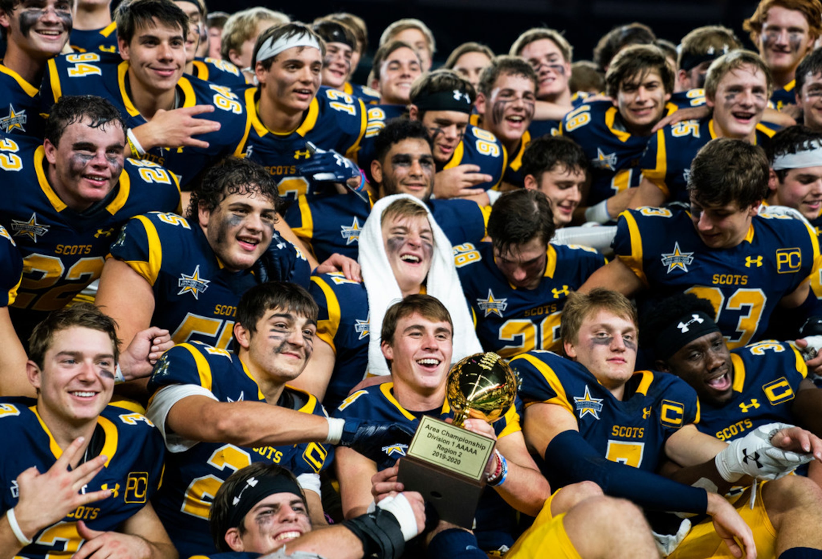 Highland Park football players celebrate a 63-28 win over Magnolia in a Class 5A Division I...