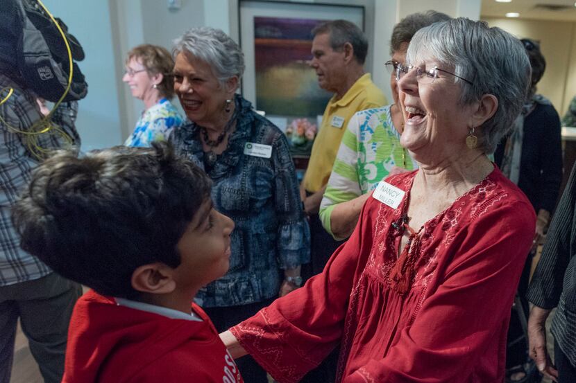 Nancy Miller greets Ahan Jain, 9, her pen pal from Good Shepherd Episcopal School, as he...