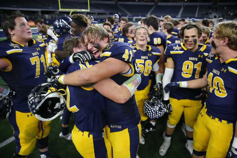 Highland Park teammates Elliott Newsom (41) and Ben Boudreaux (52) celebrate following the...